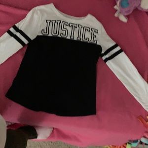 A black and white justice kids shirt